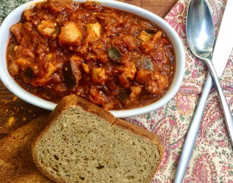 Harissa Chicken & Eggplant Stew served with a slab of homemade Bread